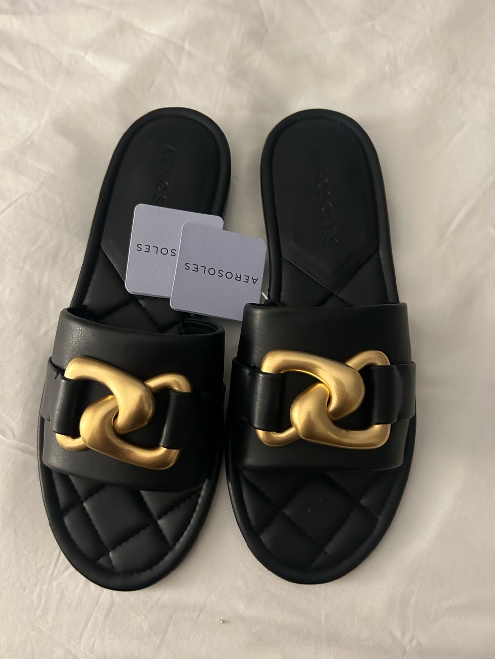 AEROSOLES Black Quilted Slide Mules with Gold Chain Detail